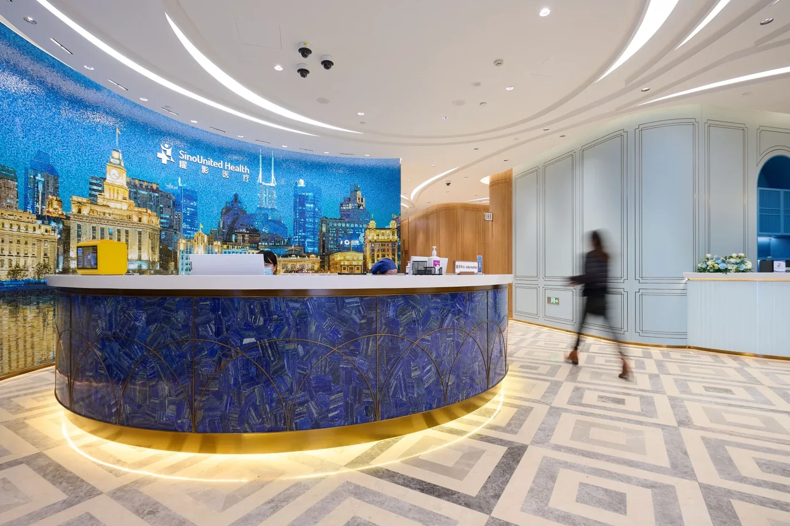 Reception at Shanghai SinoUnited Hospital with the Bund skyline artwork